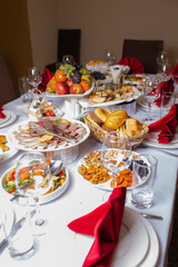 a table full of various dishes. Fruits, snacks and desserts at the event