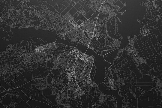 Street map of Dnipro (Ukraine) on black paper with light coming from top
