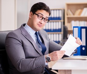 Businessman receiving letter in the office
