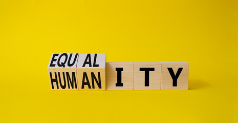 Equality and Humanity symbol. Turned cubes with words Equality and Humanity. Beautiful yellow background. Business and Equality and Humanity concept. Copy space