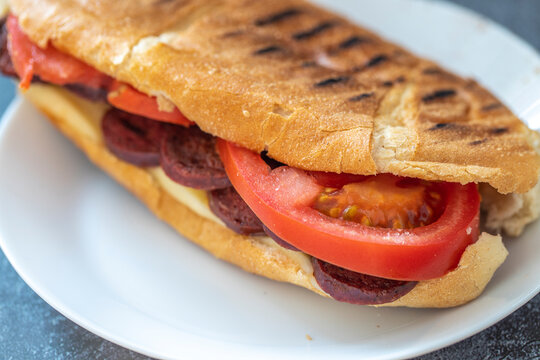 Turkish traditional toast sandwich, cheddar cheese, tomato, sausage (Turkish name; Ayvalık toast)