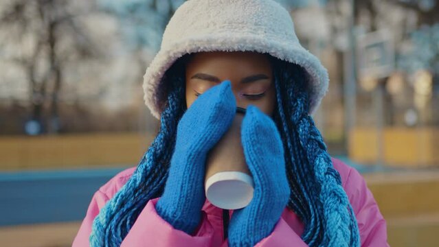 Beautiful young woman with a big  winter jacket