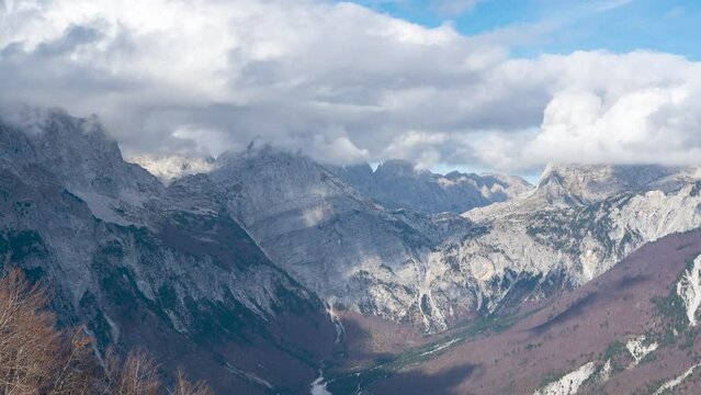 4K time lapse footage from mountains  of theth national park in albania with moving white clouds on sky and dinaric alps