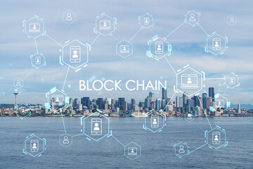 Seattle skyline with waterfront view. Skyscrapers of financial downtown at day time, Washington, USA. Decentralized economy. Blockchain, cryptography and cryptocurrency concept, hologram