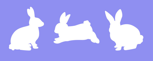 Silhouette of rabbits isolated on blue background