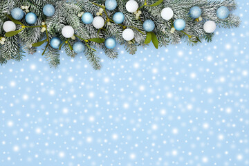 Christmas snow fir mistletoe tree bauble background border on pastel blue with sparkling ball...