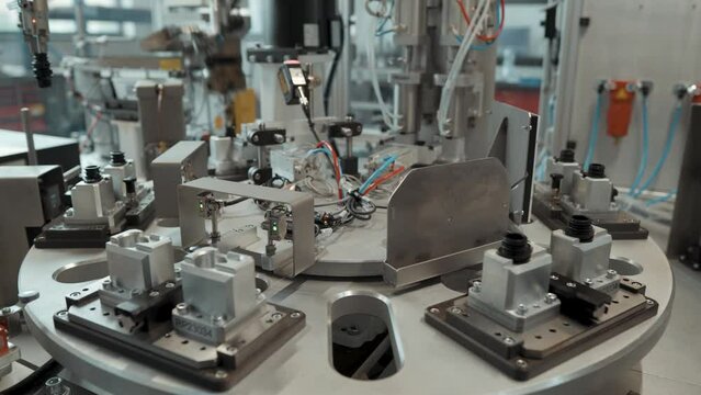 Mechanized production line with robotic arms
