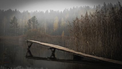 Panorama.Pier on the lake in a foggy ,autumn day in the morning in Podlasie in Poland.