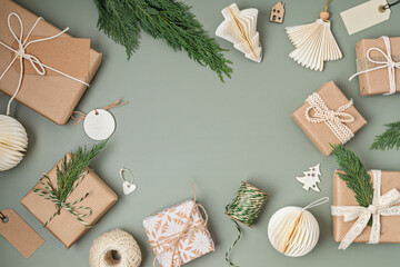 Christmas background with gift boxes and kraft wrapping paper. Xmas celebration, preparation for...