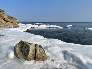The ice-covered coastal strip of one of the bays of the Ussuri Bay, Russia, Vladivostok