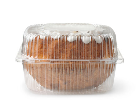 Front view of bundt cake in transparent plastic container