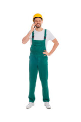 Professional repairman in uniform talking on phone against white background