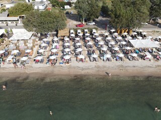 Aerial drone view plataria greece, beach crowded with tourists in vacation on summer in famous greek caribbean plataria town epirus thesprotia

