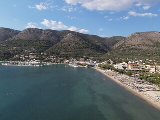 Fototapeta na wymiar Aerial drone view plataria greece, beach crowded with tourists in vacation on summer in famous greek caribbean plataria town epirus thesprotia 