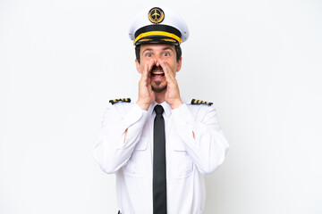 Airplane caucasian pilot isolated on white background shouting and announcing something