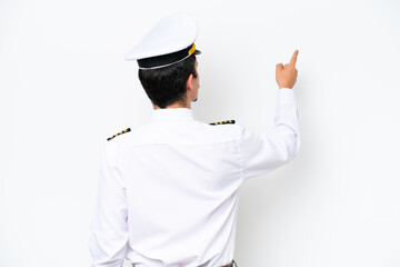 Airplane caucasian pilot isolated on white background pointing back with the index finger