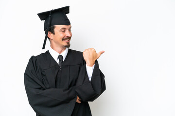 Young university graduate man isolated on white background pointing to the side to present a product
