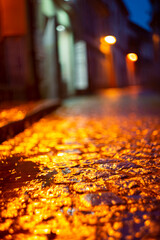 Blurred view of city street with lights at winter rainy night. Bokeh lights background. Abstract artistic photography.