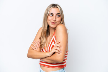 Young caucasian woman isolated on white background making doubts gesture while lifting the shoulders