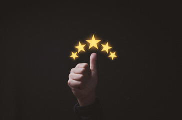Thumb up with glowing yellow five stars for excellent evaluate after customer use product service ,...