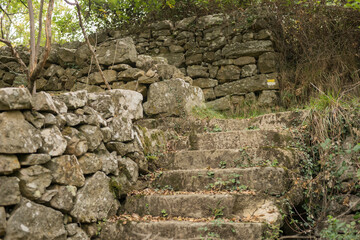 Cultural landscape in the Ardeche France at the village of Creysseilles near 07000 Privas stony path with dry masonry and stairway