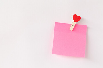 Abstract of wooden heart clip with Blank paper and stick paper on refrigerator door. paper note...
