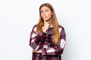 Fototapeta premium Young caucasian woman isolated on white background having doubts while looking up