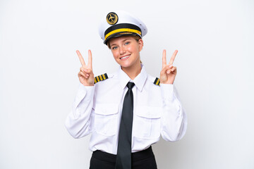 Airplane caucasian pilot woman isolated on white background showing victory sign with both hands