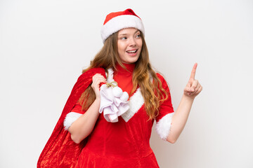 Young caucasian woman with Christmas dress holding Christmas sack isolated on white background intending to realizes the solution while lifting a finger up