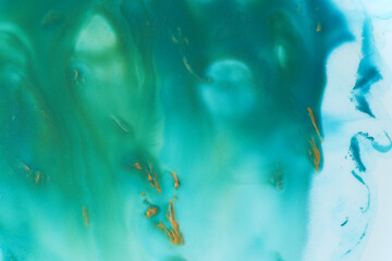 abstract creative emerald green and golden gouache background