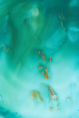 abstract creative emerald green and golden gouache background