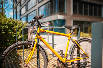 Fototapeta na wymiar Bright bike on street near building outdoors