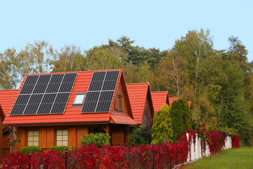 Fototapeta na wymiar Beautiful houses with solar panels outdoors. Real estate for rent