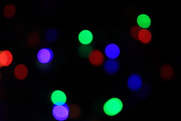 Purple Festive Christmas background. Elegant abstract background with bokeh defocused lights and stars