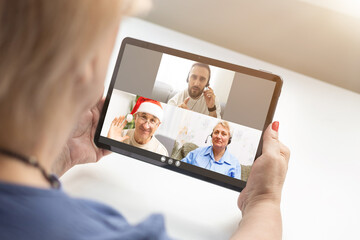 Virtual Christmas tree meeting team teleworking. Family video call remote conference. Laptop webcam...
