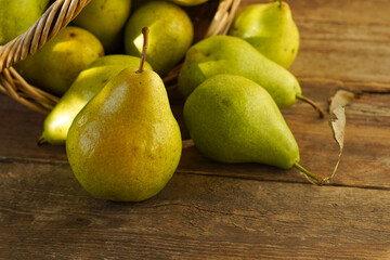 Pears on a wooden background. Fruit harvest. Autumn still life. Pear variety Bera Conference.