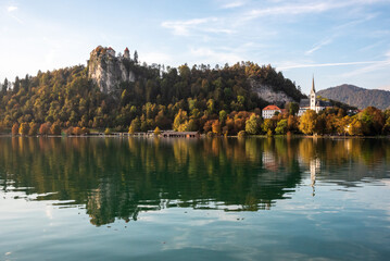 Fototapeta na wymiar Peaceful view on lake Bled and the island with its pilgrimage church Assumption of Mary, Slovenia