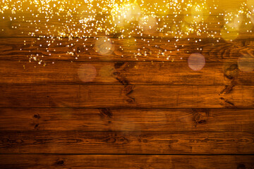 Glowing Christmas tree garland on a wooden background