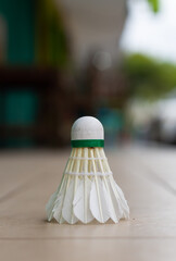 Photo of a shuttlecock with a blurred background.