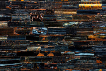 Tiger Eye Blue slab. Precious mineral quartz pattern. Exclusive luxury gemstone background. Natural semi precious stone texture. Material, background for unique interior, exterior design decoration.