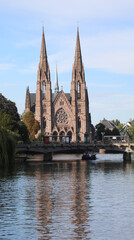 Fototapeta na wymiar St Paul's Church in the city Strasbourg and the navigable river ILL i