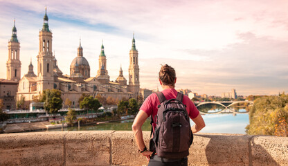 Man tourist looking at basilica of Saragossa,  Aragon in Spain- Zaragoza