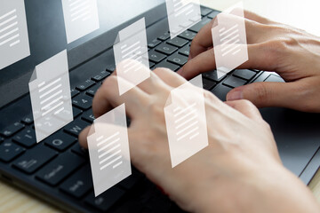 Woman holds pen and writing to send electronic document or take note and another hand using laptop. Business and Marketing strategy and concept.