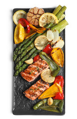 Tasty grilled salmon with lemon and vegetables on white background, top view