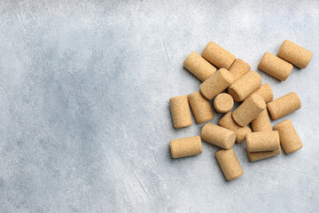 Wine bottle corks on light grey table, flat lay. Space for text