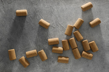 Wine bottle corks on grey table, flat lay