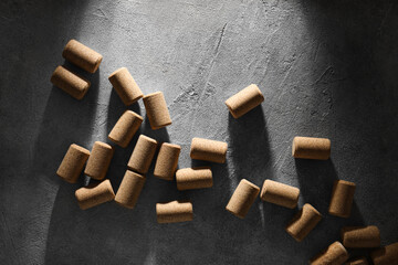 Wine bottle corks on grey table, flat lay