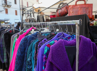 used clothes and sweaters for sale at flea market