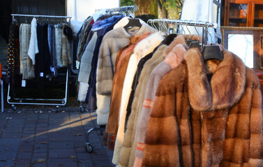 Fototapeta na wymiar fur Coaat and winter clothing for sale at market