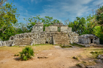 Fototapeta na wymiar Mayan ruins in shadow of trees in jungle tropical forest Playa del Carmen, Riviera Maya, Yu atan, Mexico